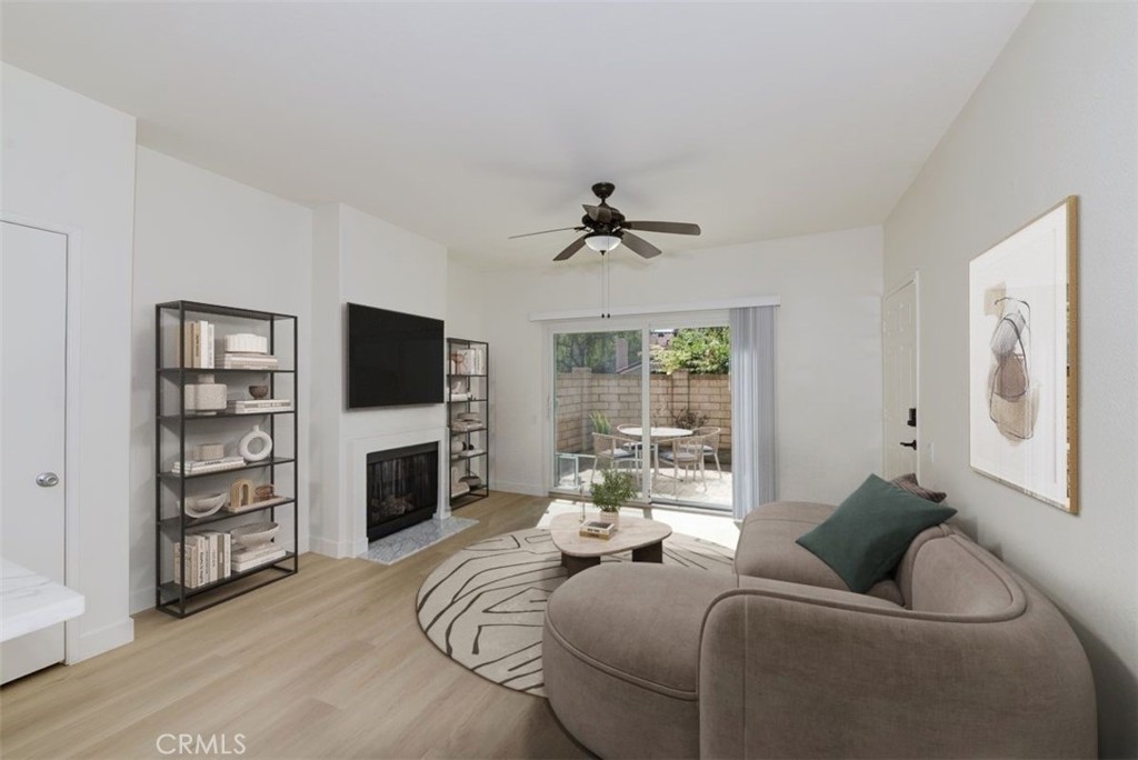 Generous sized living room (virtually staged) - 29012 Canyon Ridge 120, Lake Forest CA 92679 - photo 3