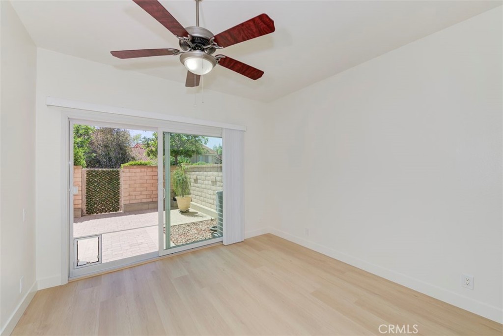 Large bedroom with new slider opens to backyard - 29012 Canyon Ridge 120, Lake Forest CA 92679 - photo 6