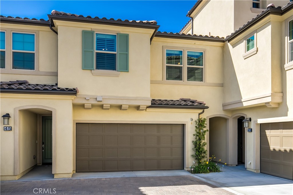Two car attached garage with a private foyer entrance. - 47 Prominence, Lake Forest CA 92630 - photo 23