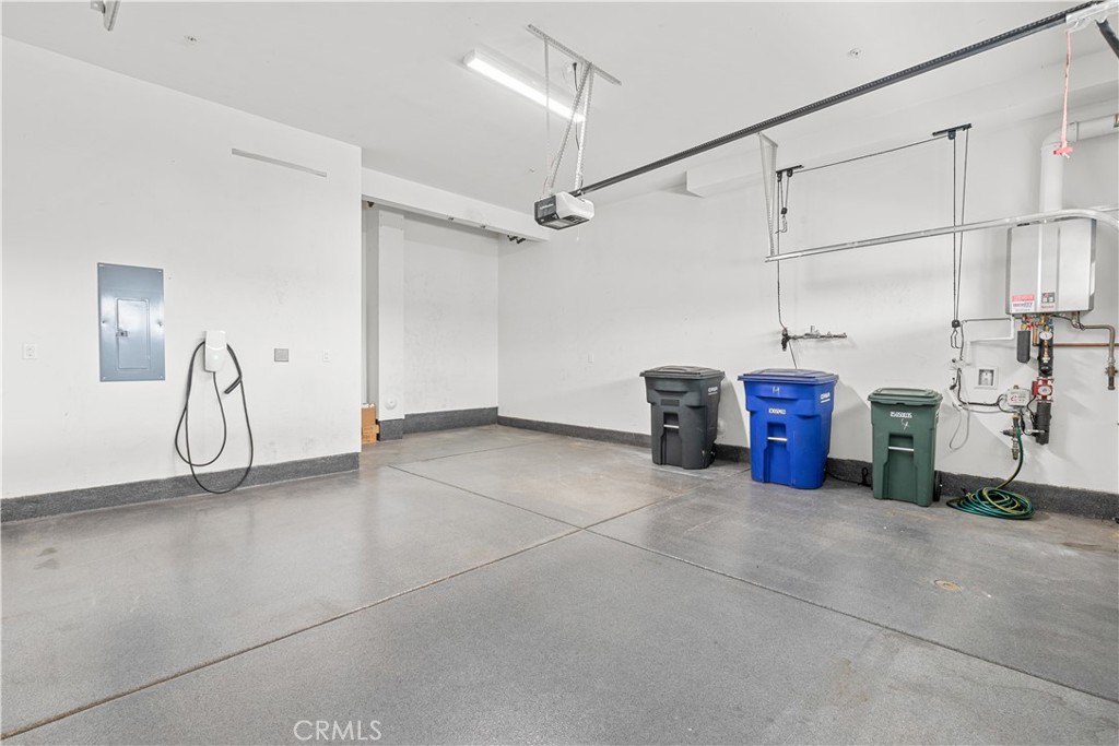 Garage w/ Tesla car charger - 604 White Oaks, Lake Forest CA 92610 - photo 8