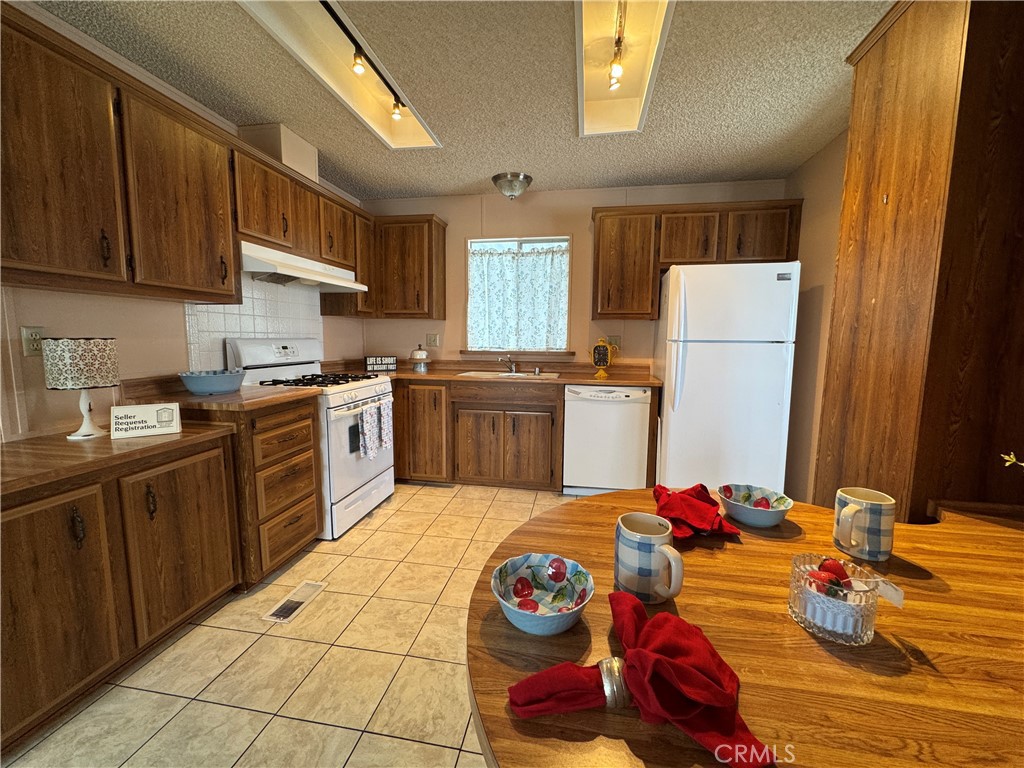 Kitchen View from the Den - 10681 Oak Street 58, Los Alamitos CA 90720 - photo 7