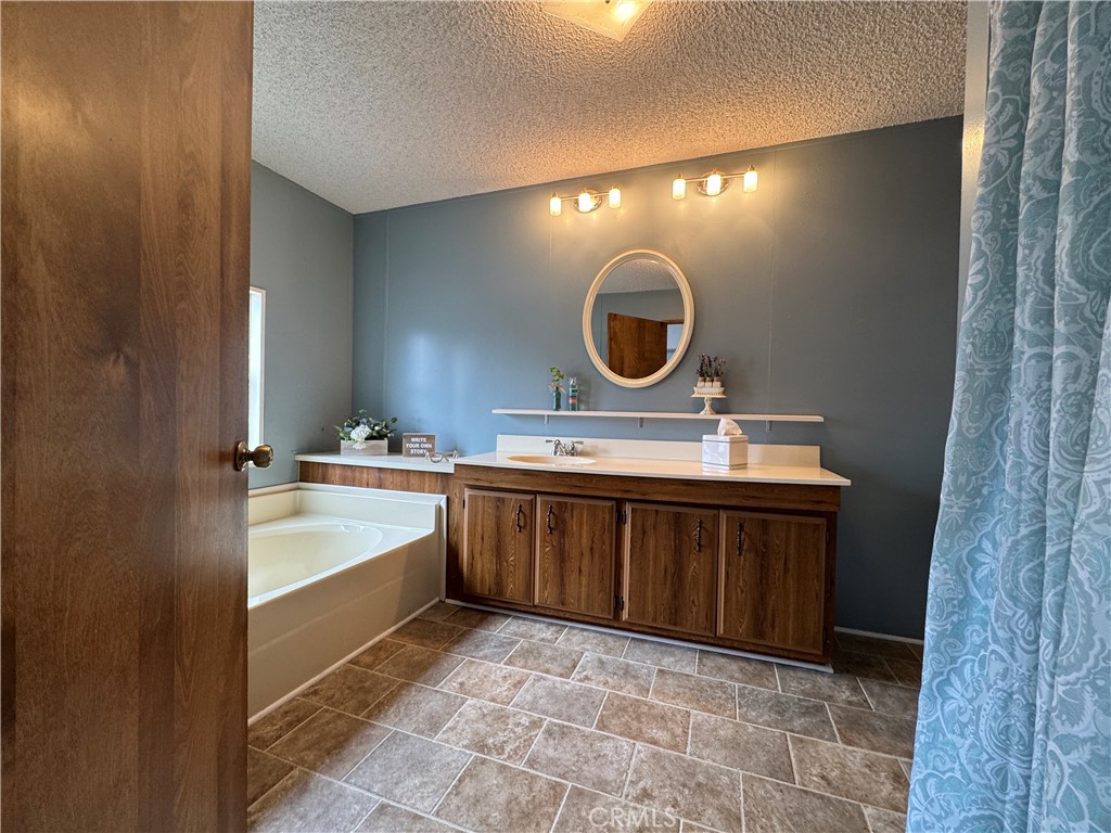 Master Bath Entry from Bedroom - 10681 Oak Street 58, Los Alamitos CA 90720 - photo 16