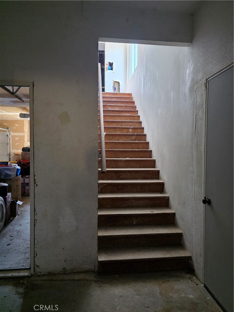 stairs leading to upstairs quarters - 11101 Essex Drive, Los Alamitos CA 90720 - photo 3