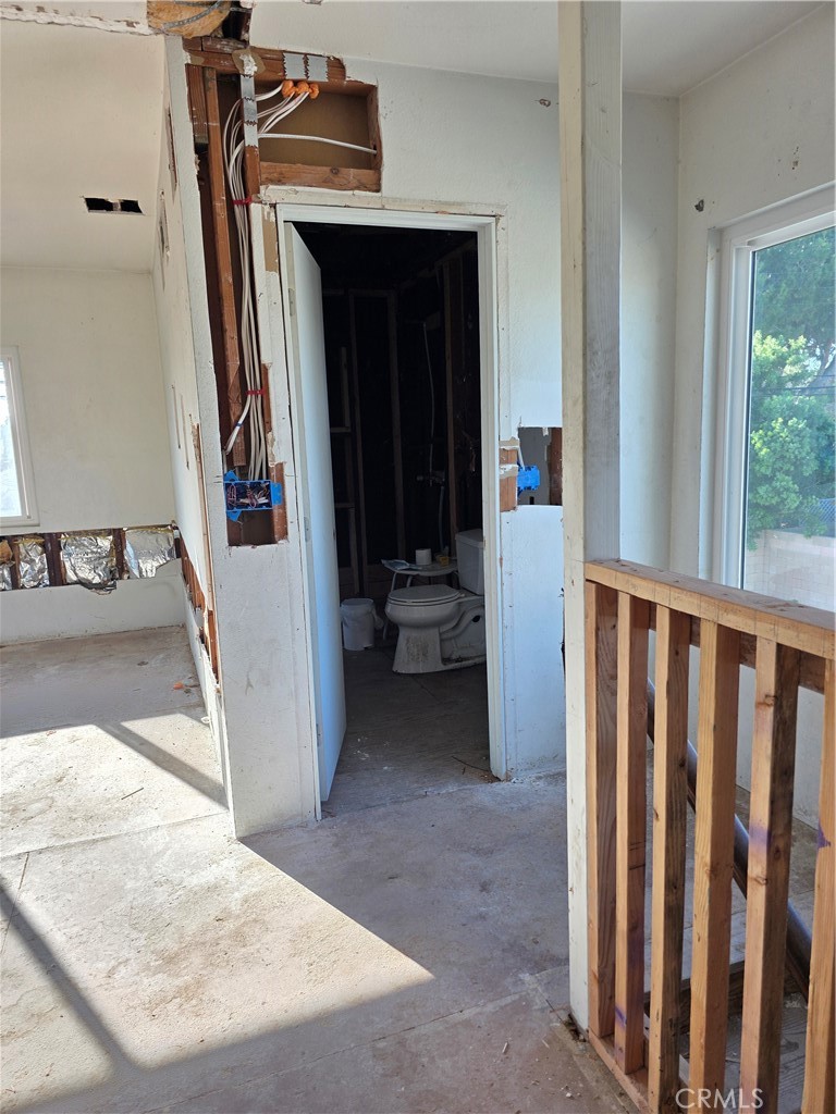 View showing half bath and top of staircase landing - 11101 Essex Drive, Los Alamitos CA 90720 - photo 10