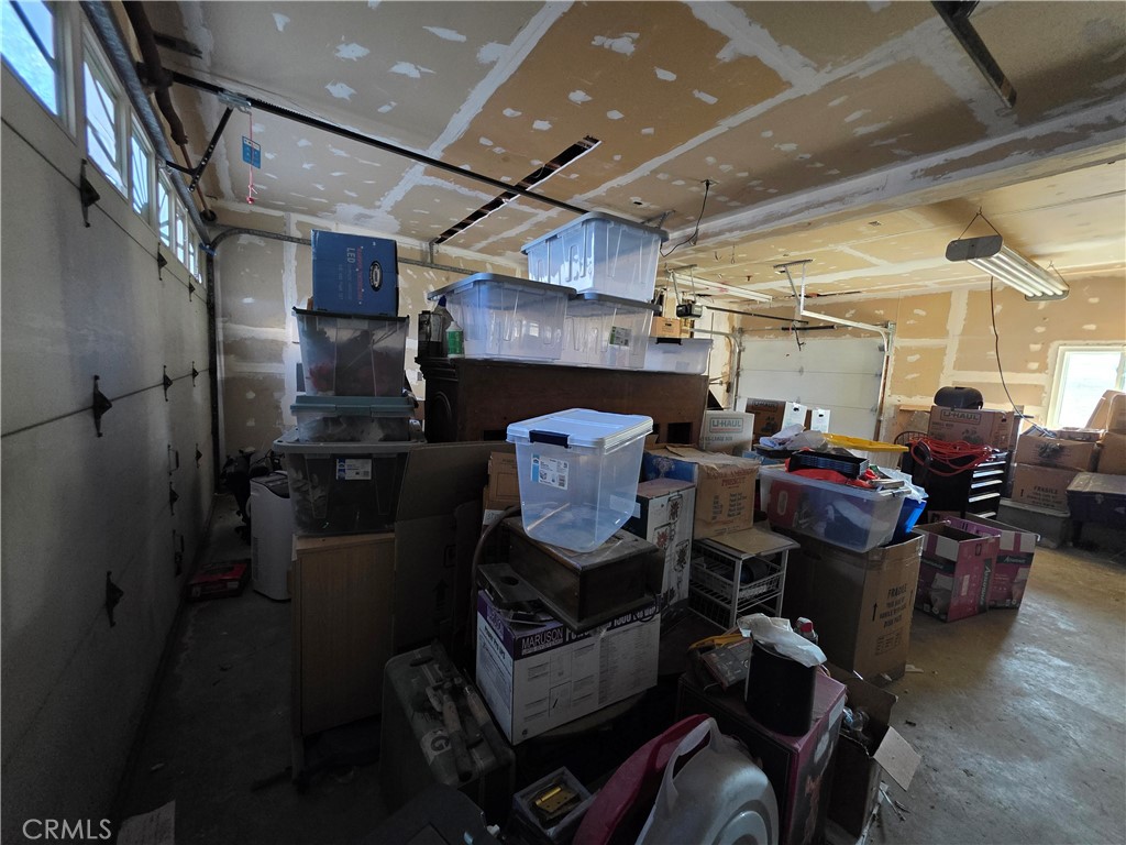 View of oversized garage showing 3rd garage door leading to back yard - 11101 Essex Drive, Los Alamitos CA 90720 - photo 12