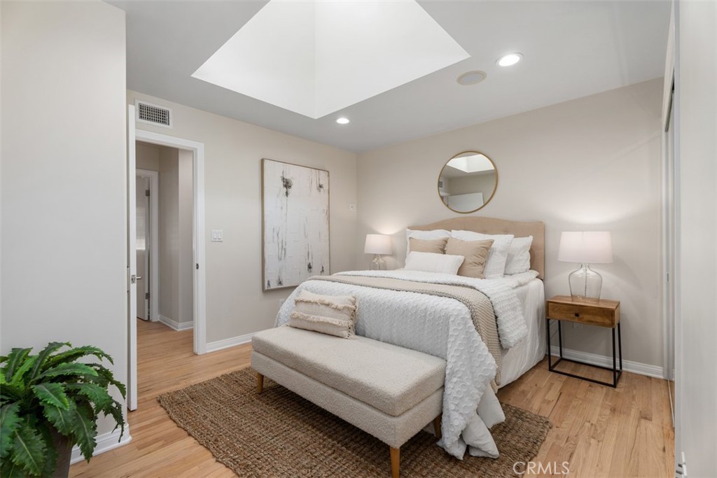 Bedroom 1: beautiful custom skylight, LED recessed lights, mirrored closet doors. - 11772 Paseo Bonita, Los Alamitos CA 90720 - photo 7
