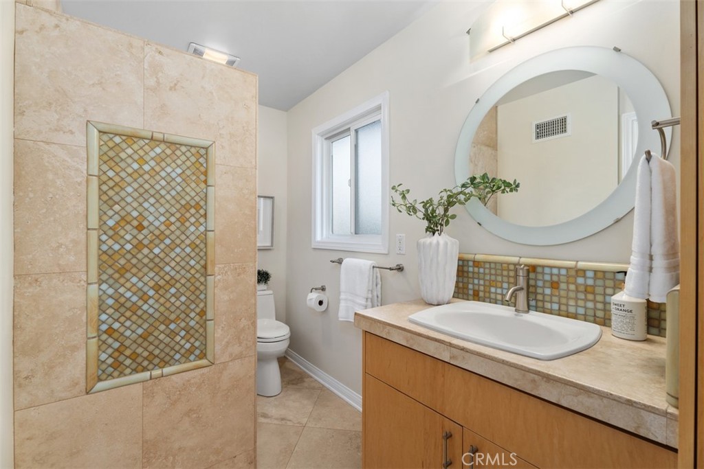 Bathroom 1: added on by previous owner. Stand up glass enclosed shower not visible in this shot. Addition was permitted. - 11772 Paseo Bonita, Los Alamitos CA 90720 - photo 15