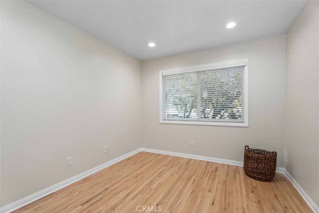 Bedroom 2, window faces backyard, mirrored closet doors, newly installed LED recessed lighting. - 11772 Paseo Bonita, Los Alamitos CA 90720 - photo 17