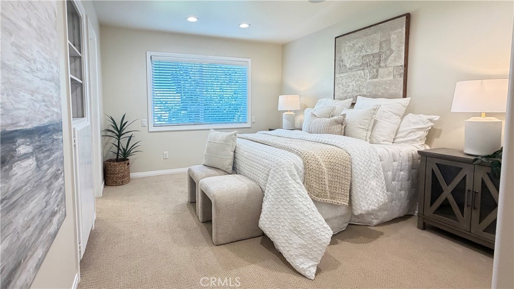 Primary bedroom: new carpet, dual pane window, recessed LED lights, walk in closet. - 11772 Paseo Bonita, Los Alamitos CA 90720 - photo 19