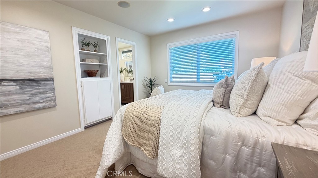 Primary bedroom: newly installed carpet, wired for sound, LED recessed lighting, dual pane windows. - 11772 Paseo Bonita, Los Alamitos CA 90720 - photo 21