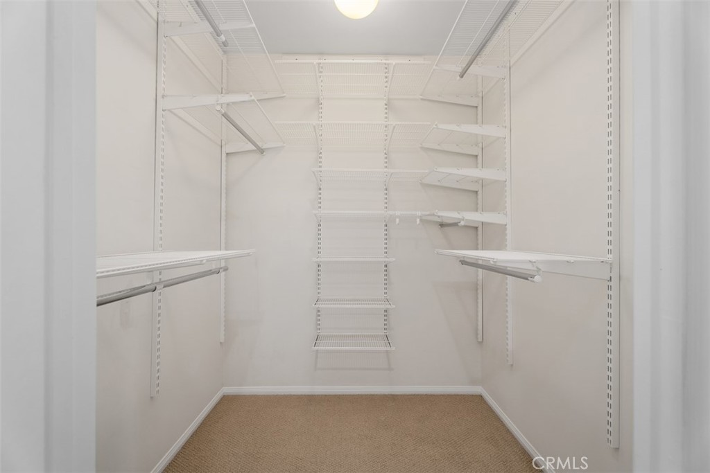 Primary walk-in closet with Elfa organizing system (additional shelving pieces available so you can customize things “yo - 11772 Paseo Bonita, Los Alamitos CA 90720 - photo 22