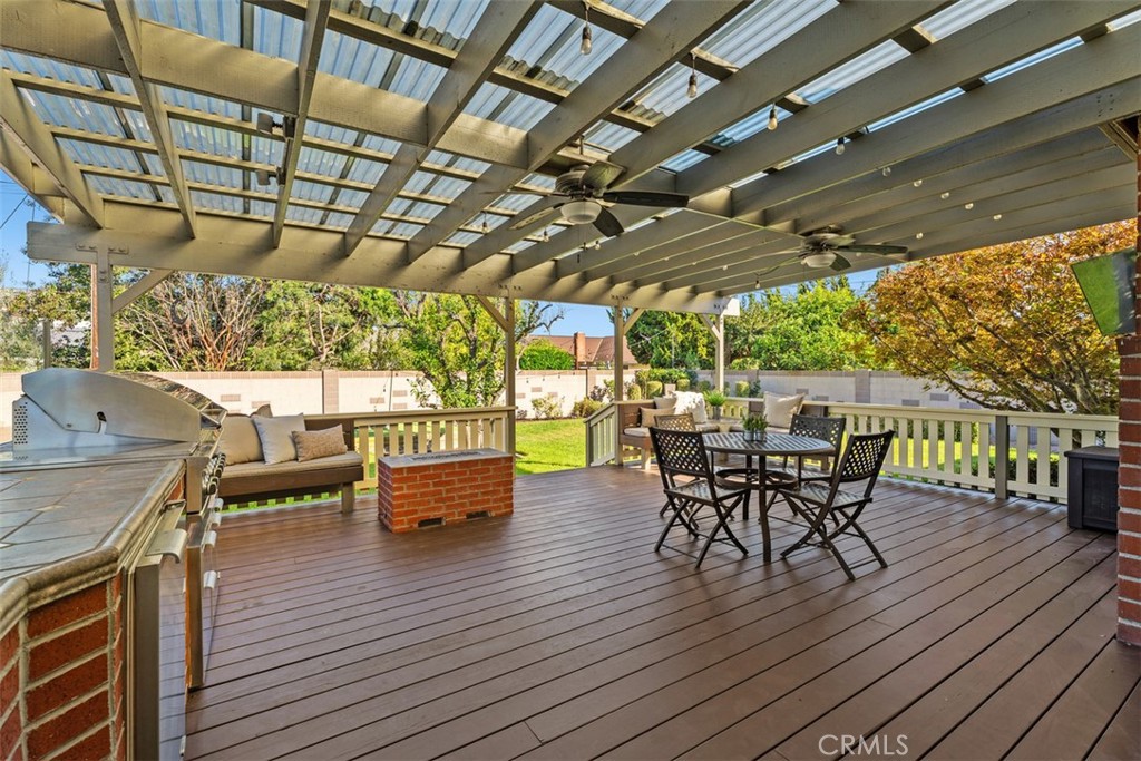 Giant patio with Built-in BBQ, two separate burners, storage and custom countertop with glass enclosure and patio cover. - 11772 Paseo Bonita, Los Alamitos CA 90720 - photo 26