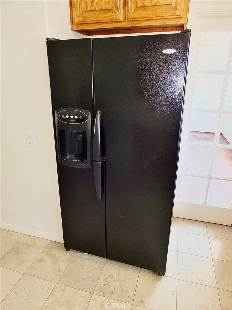 Side by side refrigerator with water feature. included in the sale. - 4441 Farquhar, Los Alamitos CA 90720 - photo 18