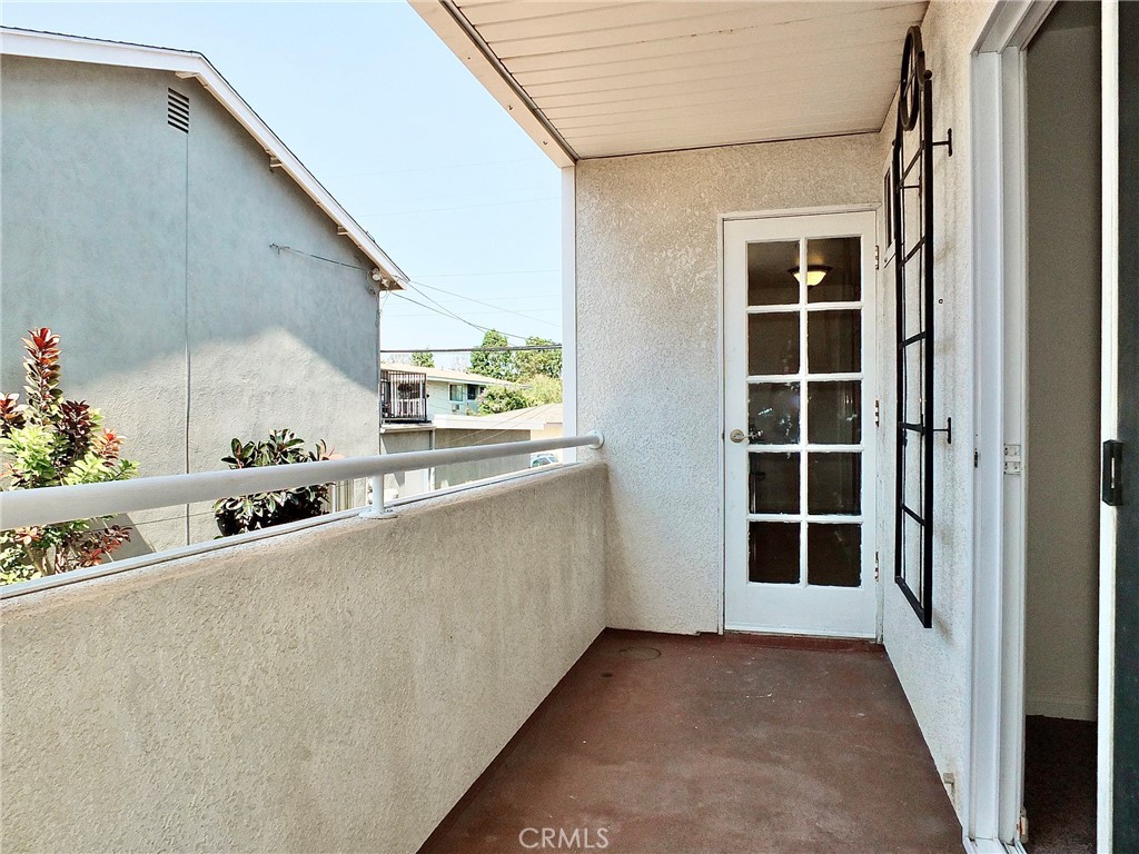 Balcony off office/playroom leading to kitchen - 4441 Farquhar, Los Alamitos CA 90720 - photo 22