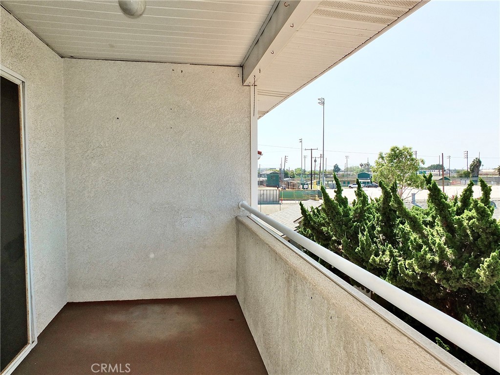 View from primary balcony looking out to baseball field. - 4441 Farquhar, Los Alamitos CA 90720 - photo 36