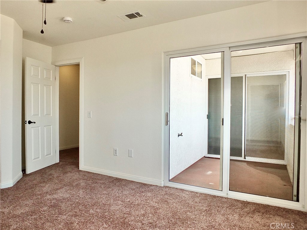 view from back bedroom looking across the connecting balcony to the other room. - 4441 Farquhar, Los Alamitos CA 90720 - photo 42