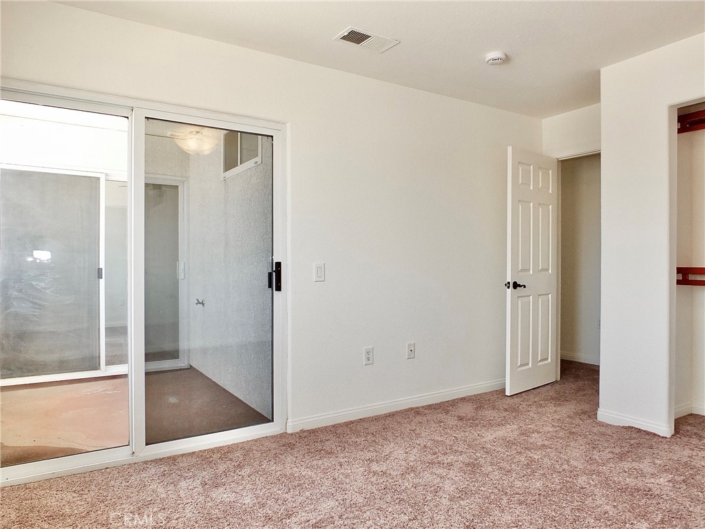 View looking from this bedroom across balcony bedroom to other back bedroom. - 4441 Farquhar, Los Alamitos CA 90720 - photo 48