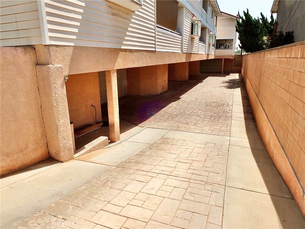 View of driveway down to the garage. - 4441 Farquhar, Los Alamitos CA 90720 - photo 54