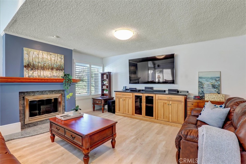 Built-In entertainment center and cozy Fireplace. - 5021 Apollo Circle, Los Alamitos CA 90720 - photo 7