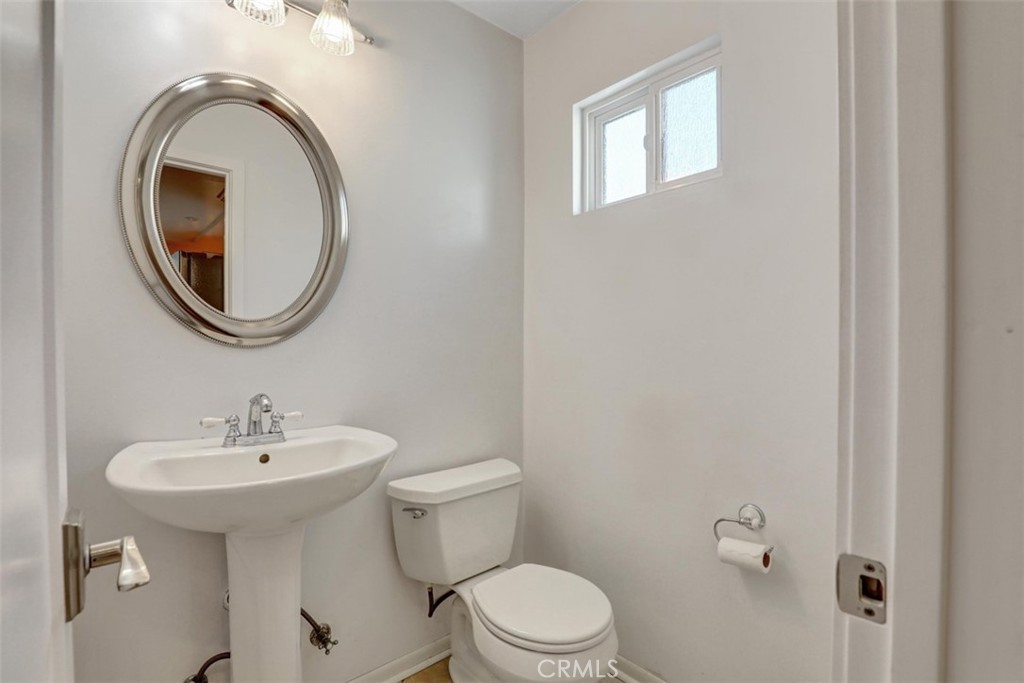 Guest 1/2 bath downstairs - 5021 Apollo Circle, Los Alamitos CA 90720 - photo 25