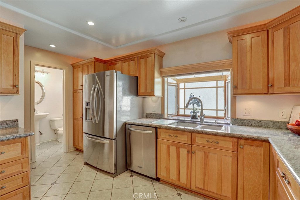 Kitchen towards 1/2 bath. - 5021 Apollo Circle, Los Alamitos CA 90720 - photo 26
