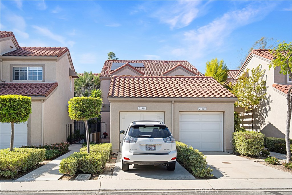 1 Car Garage ~ Driveway accommodates another vehicle - 21901 Barbados, Mission Viejo CA 92692 - photo 1