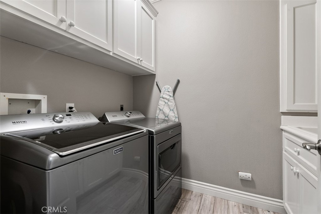 laundry room with sink & storage - 22801 Maiden Lane, Mission Viejo CA 92692 - photo 39