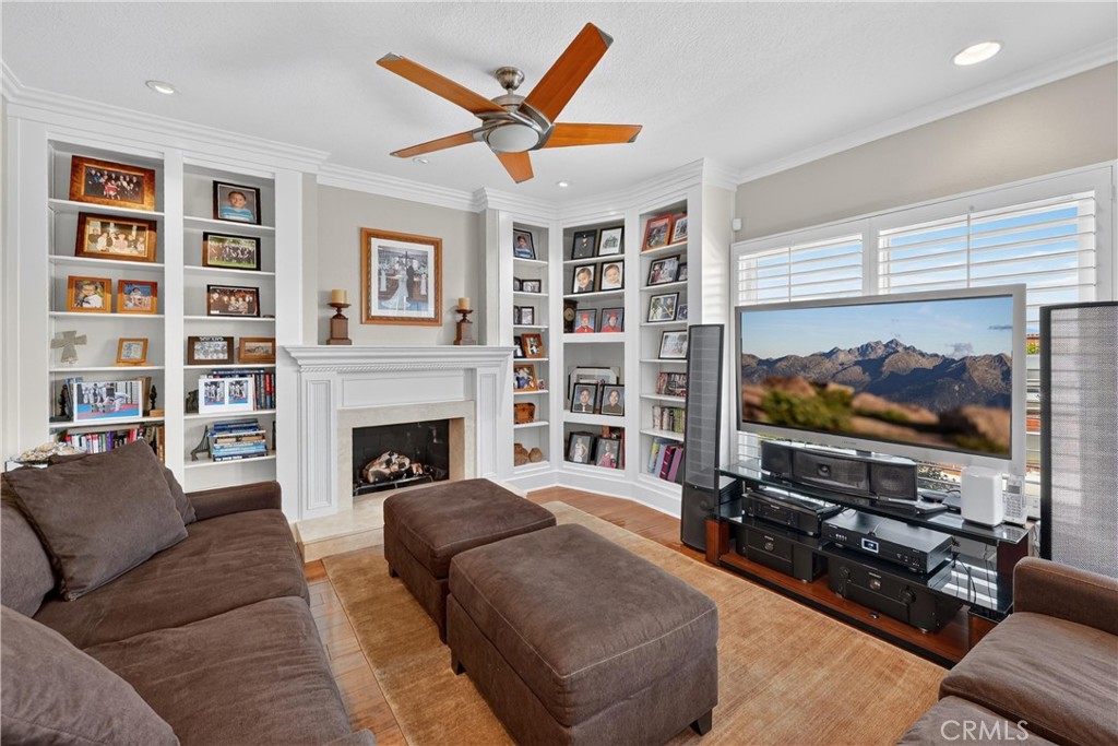 Family room also has a fireplace and custom built-in's. - 22852 Buendia, Mission Viejo CA 92691 - photo 20