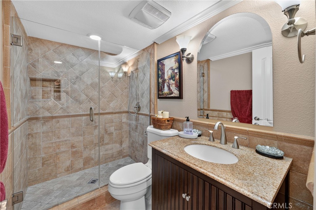 Remodeled downstairs bathroom with large shower. - 22852 Buendia, Mission Viejo CA 92691 - photo 27