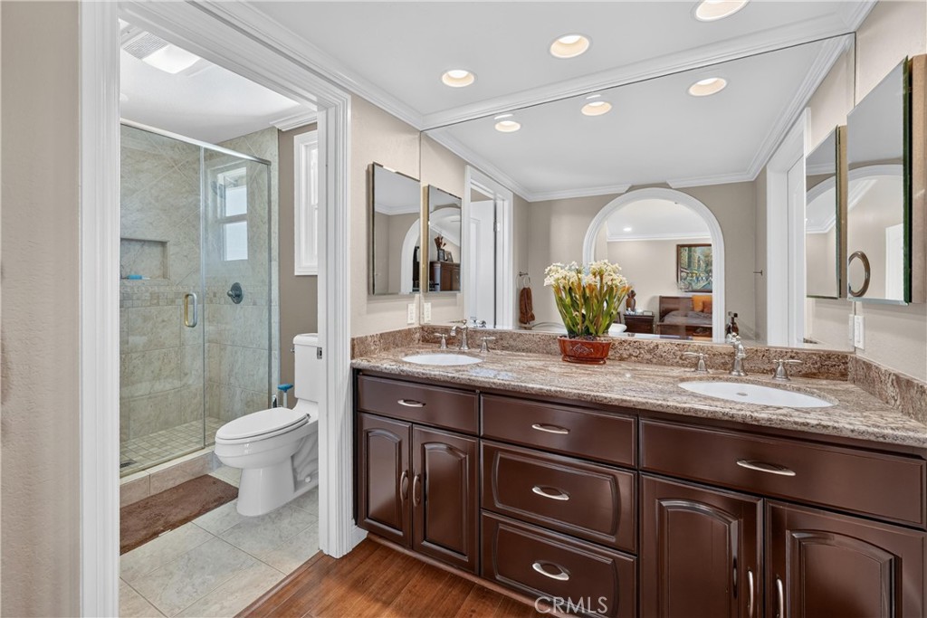 Primary Bathroom was remodeled with double sinks and custom cabinets. - 22852 Buendia, Mission Viejo CA 92691 - photo 44
