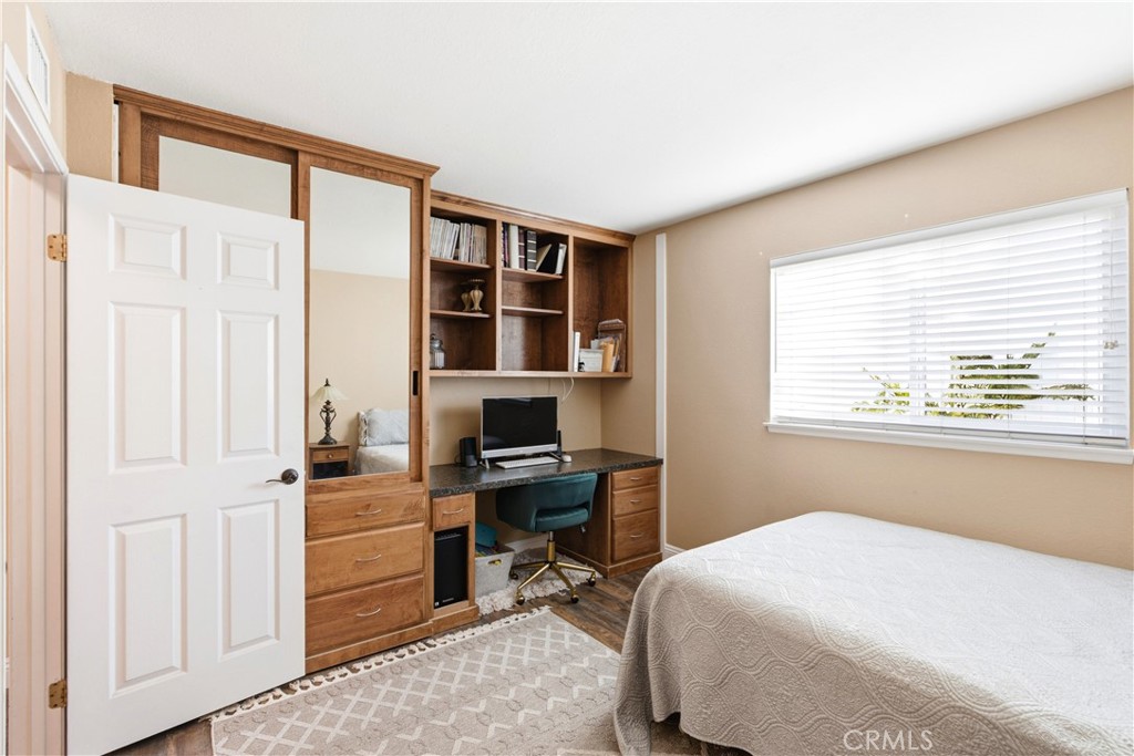 Bedroom 2 features custom built-in desk and closet with drawers - 23001 Via Santa Maria, Mission Viejo CA 92691 - photo 16
