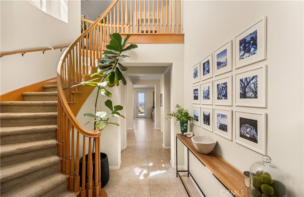 Architectural features include a semi circular staircase that leads you to the 2nd story living space. - 23041 Poplar, Mission Viejo CA 92692 - photo 6