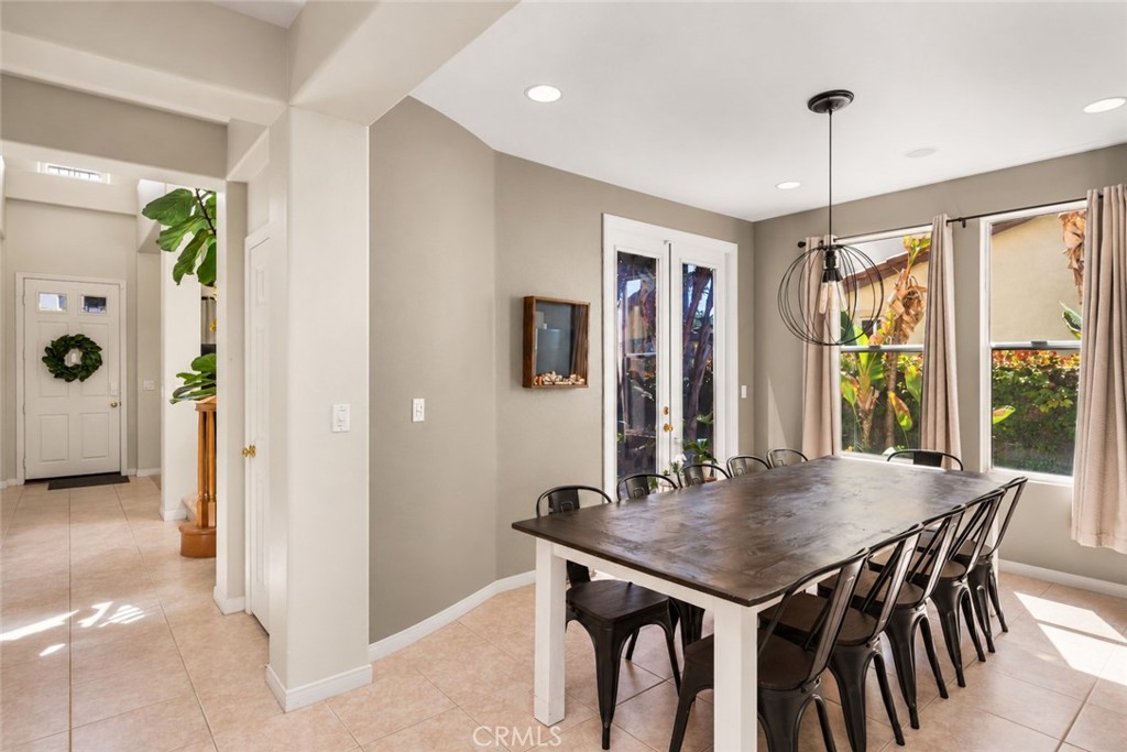 Formal dining room with custom chandelier and access to the courtyard. - 23041 Poplar, Mission Viejo CA 92692 - photo 7