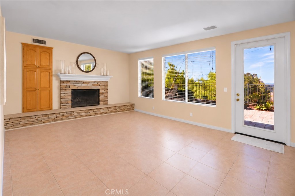 Spacious family room with views of city lights. - 23041 Poplar, Mission Viejo CA 92692 - photo 10