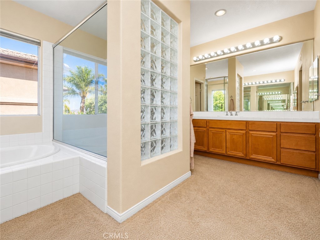 Primary bath with soaking tub, walk-in shower and dual vanities. - 23041 Poplar, Mission Viejo CA 92692 - photo 23