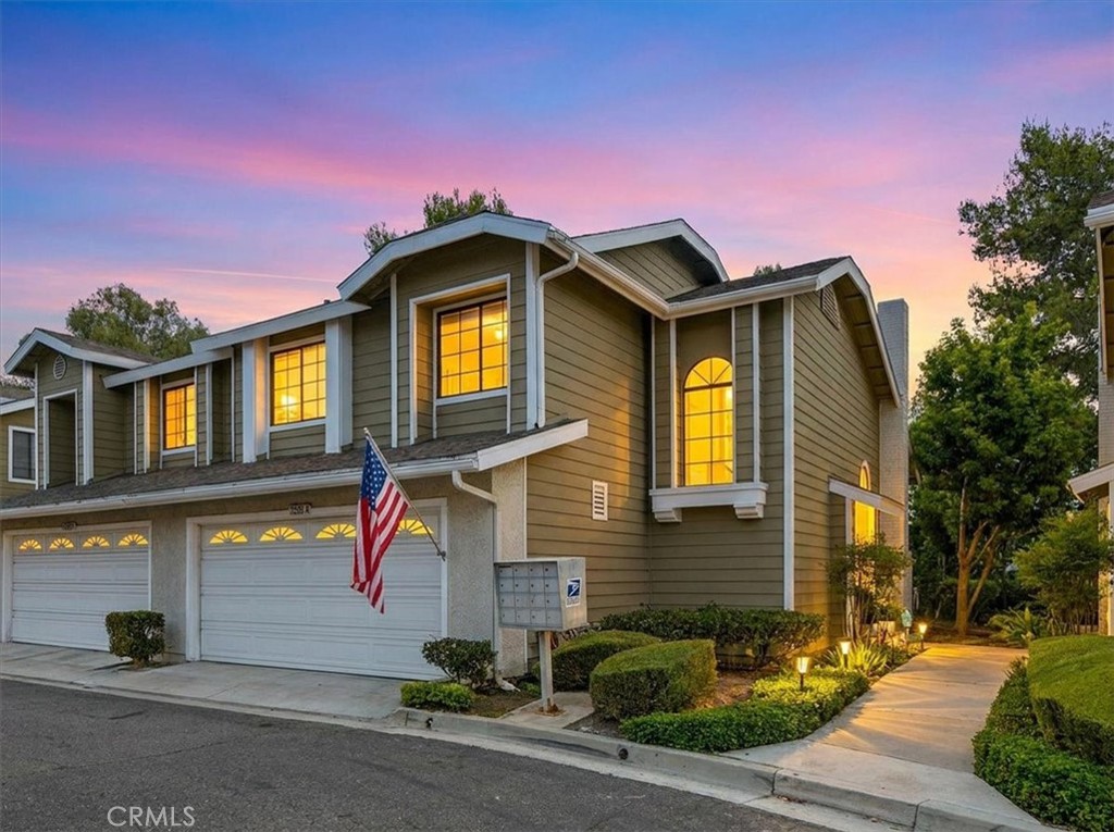 Beautiful exterior view showcasing the home’s attractive façade and manicured la - 23391 Via Linda 48, Mission Viejo CA 92691 - photo 1
