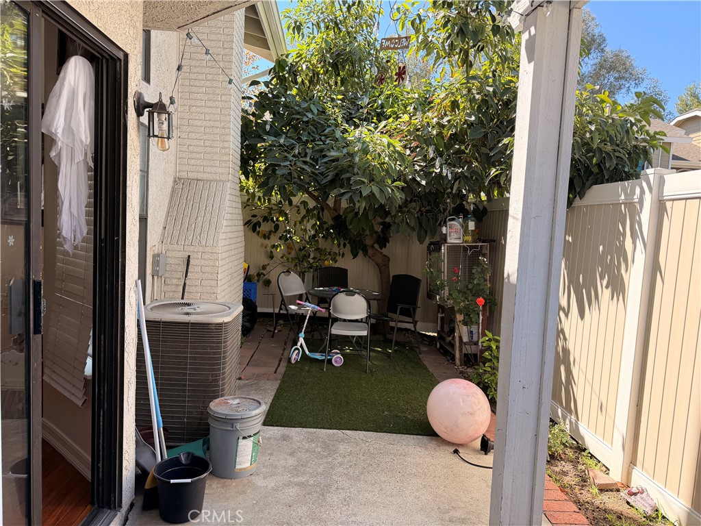 Spacious patio with turf and patio cover. - 23431 Via Linda D-or-#65, Mission Viejo CA 92691 - photo 10