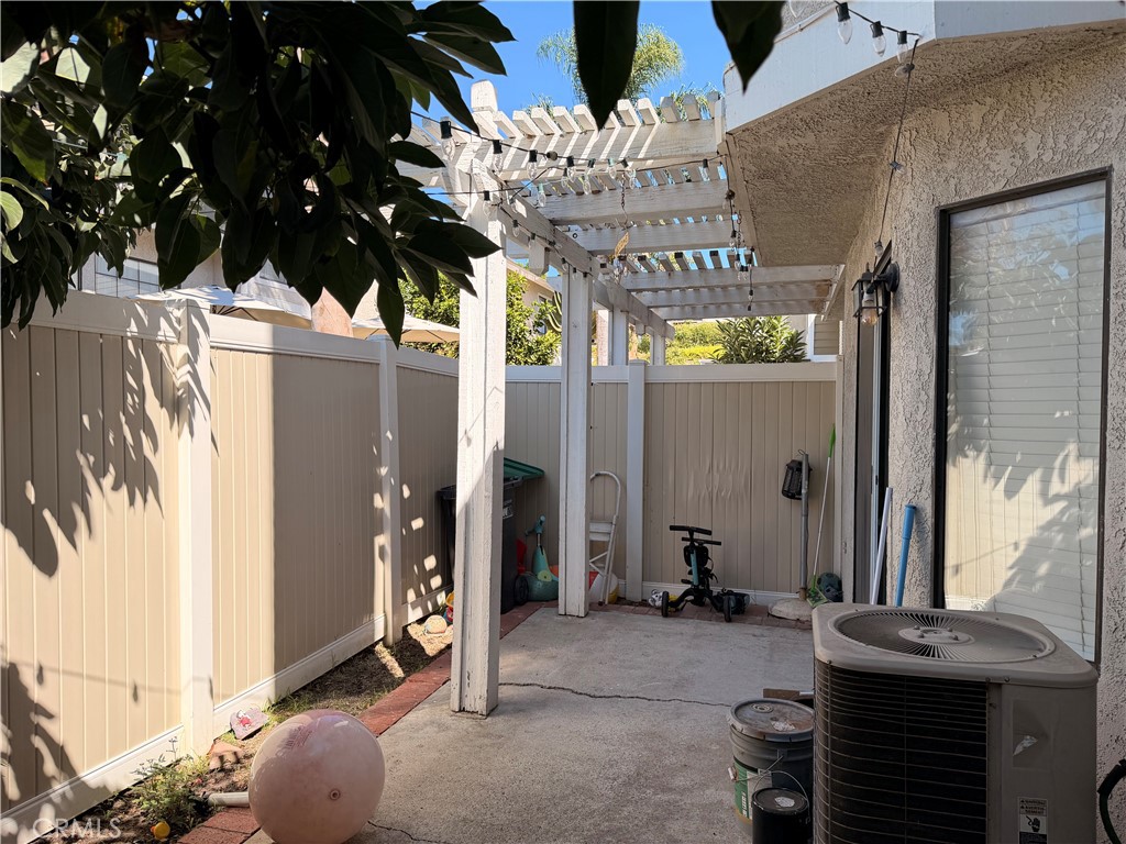 Spacious patio with turf and patio cover. - 23431 Via Linda D-or-#65, Mission Viejo CA 92691 - photo 11