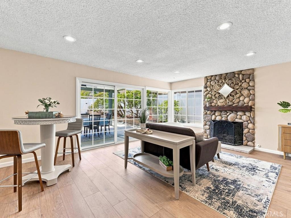 Separate family room with fireplace and slider access to covered patio - 23862 Copenhagen, Mission Viejo CA 92691 - photo 10