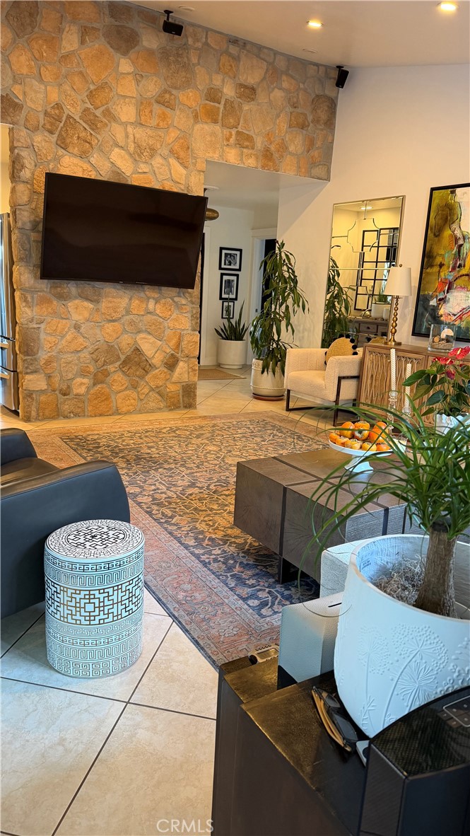 Living room with gorgeous stone wall - 23991 Woodstone, Mission Viejo CA 92691 - photo 2