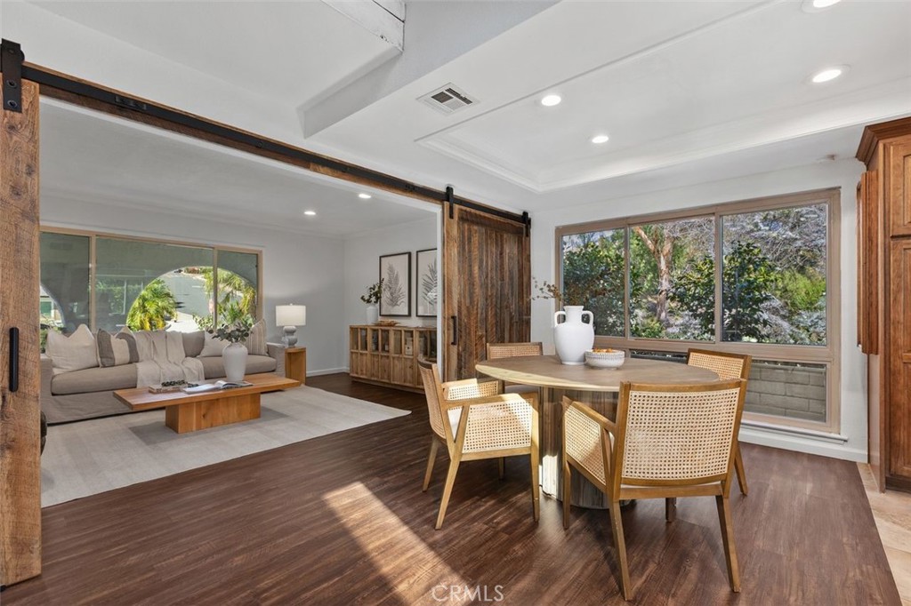 The den is just off the living room with a sliding barn door. - 24832 El Cortijo, Mission Viejo CA 92691 - photo 6