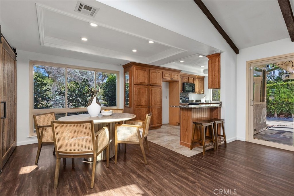 The open concept kitchen flows from the dining area. - 24832 El Cortijo, Mission Viejo CA 92691 - photo 7