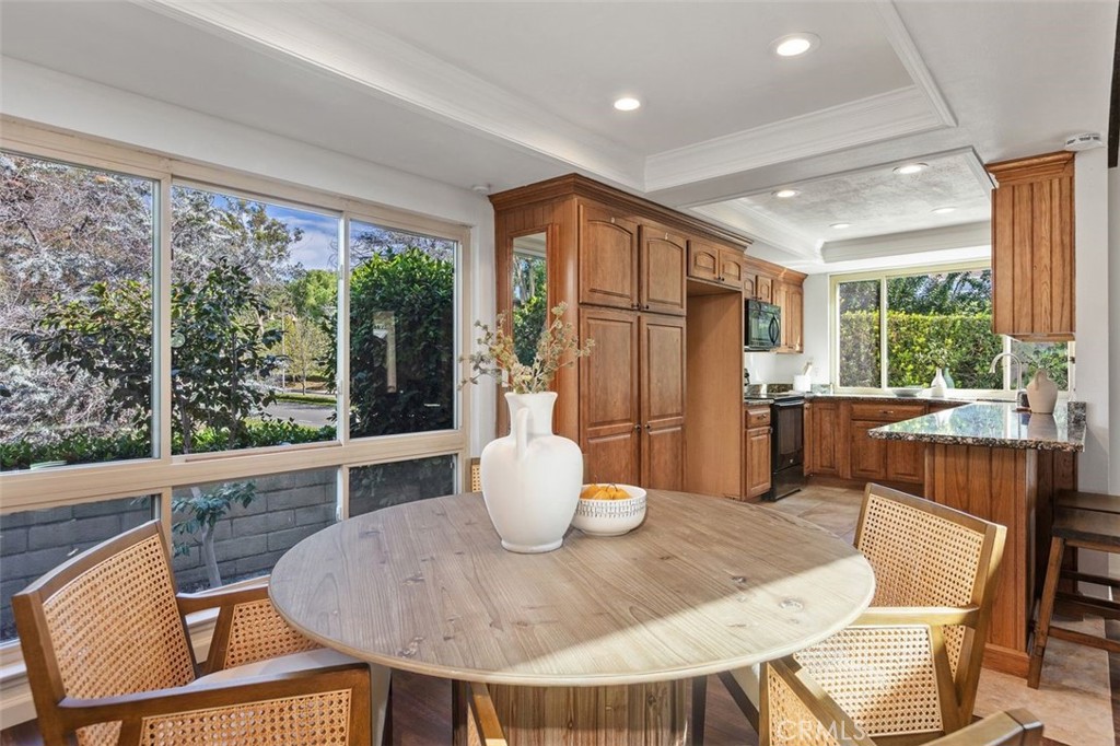 The foliage outside can be enjoyed from the dining area. - 24832 El Cortijo, Mission Viejo CA 92691 - photo 8