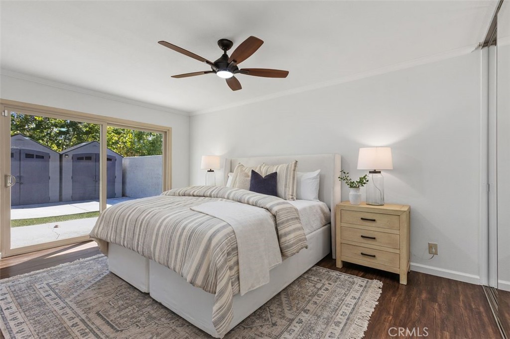 Primary bedroom with a slider and views to the backyard. - 24832 El Cortijo, Mission Viejo CA 92691 - photo 17