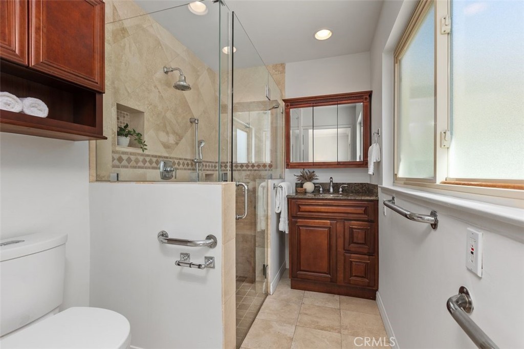 Primary bathroom with a walk-in shower. - 24832 El Cortijo, Mission Viejo CA 92691 - photo 18