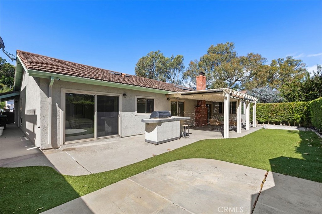 The backyard also includes a built-in BBQ area. - 24832 El Cortijo, Mission Viejo CA 92691 - photo 22