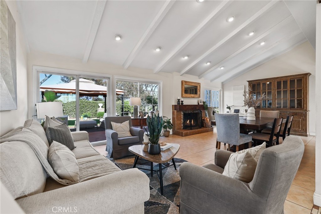 Spacious open-concept living area with vaulted ceilings, abundant natural light, and modern finishes. - 25242 Terreno Drive, Mission Viejo CA 92691 - photo 1