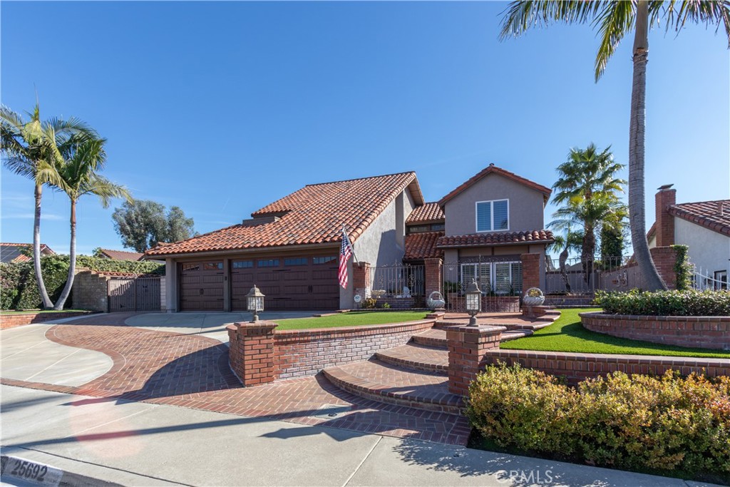 Impeccable curb appeal at this address, plus a spectacular pool, spa and view in back!! - 25692 Morales, Mission Viejo CA 92691 - photo 1