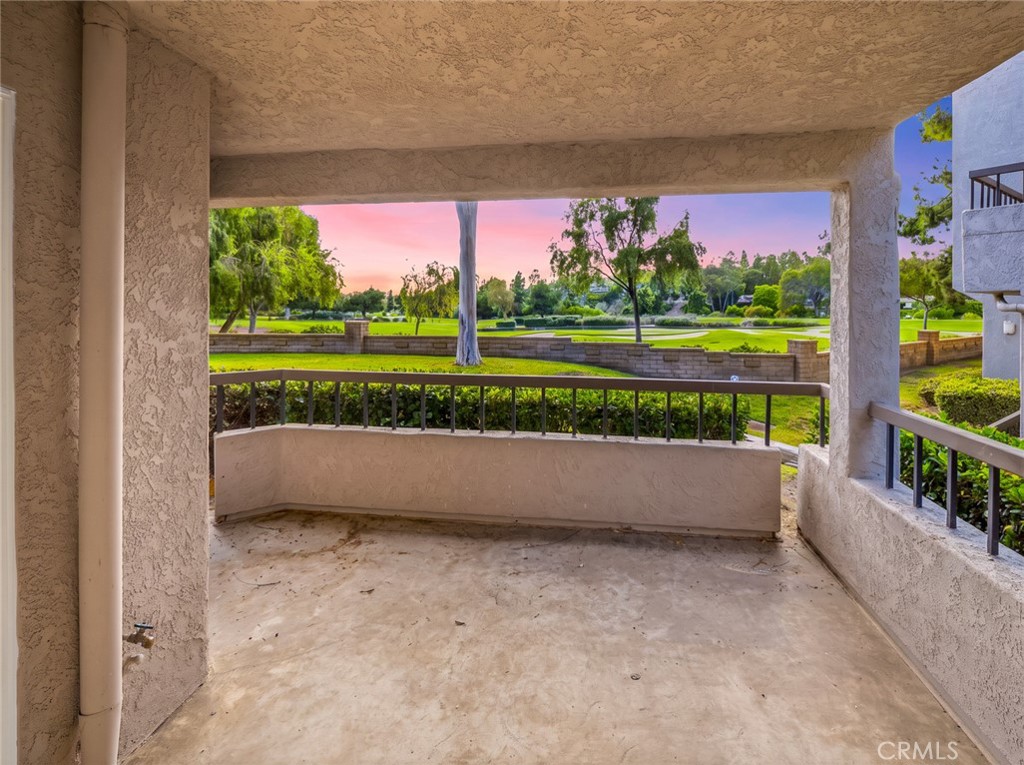 Living room, wide view toward the dining area. - 25911 Blascos 102, Mission Viejo CA 92691 - photo 4