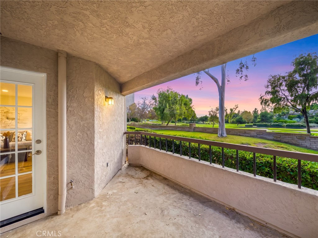 Covered patio with open golf course views. - 25911 Blascos 102, Mission Viejo CA 92691 - photo 5